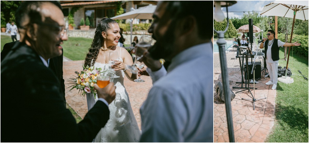 La sposa brinda con gli ospiti durante l'aperitivo e la postazione musicale in giardino