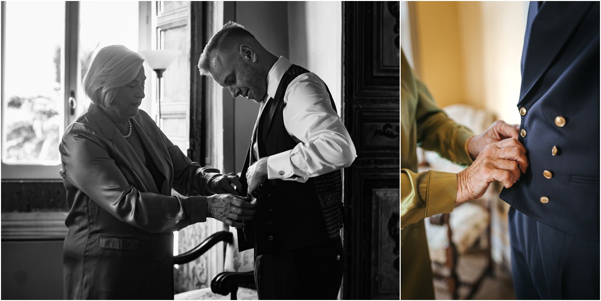Buttoning the Groom Waistcoat Black and white photo of a woman buttoning the waistcoat of groom Angus, with a detail of the gold buttons