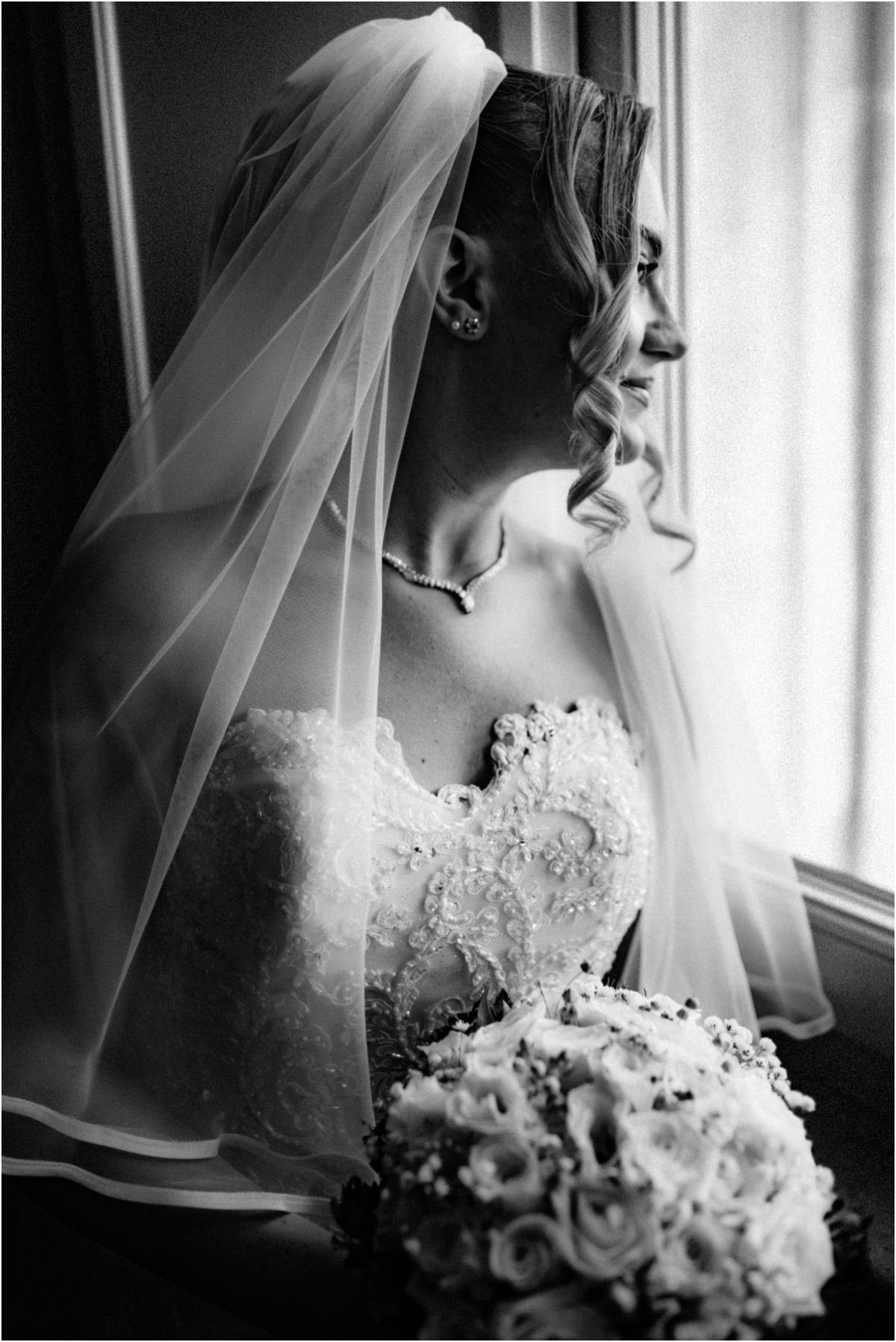 Bride Profile Portrait, Black and White Black and white profile portrait of bride Miriana in her veil, holding her bouquet by the window