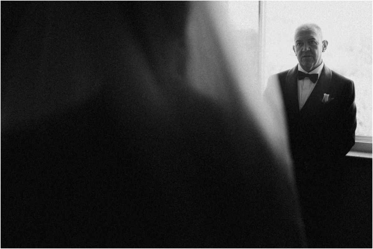 Waiting for the Bride, Black and White Black and white photo of a man in a tuxedo looking at the bride, seen through her veil