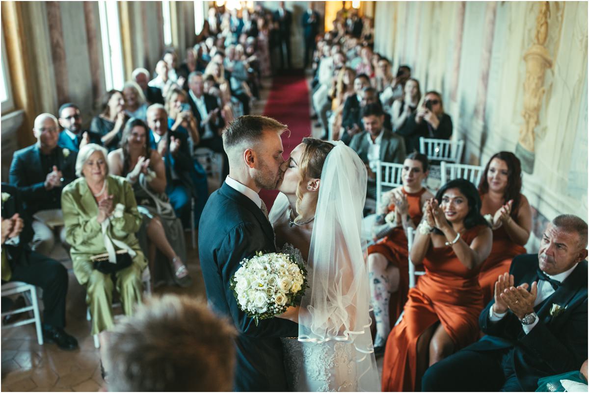 First Kiss as Husband and Wife Miriana and Angus sharing their first kiss as husband and wife while guests applaud in the Pannini Gallery