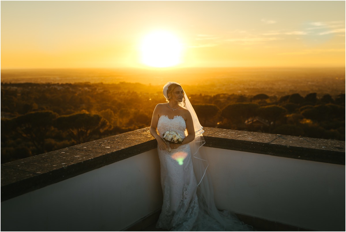 Bride in the Sunset Light Bride Miriana standing on the terrace of Villa Grazioli with the sun setting behind her