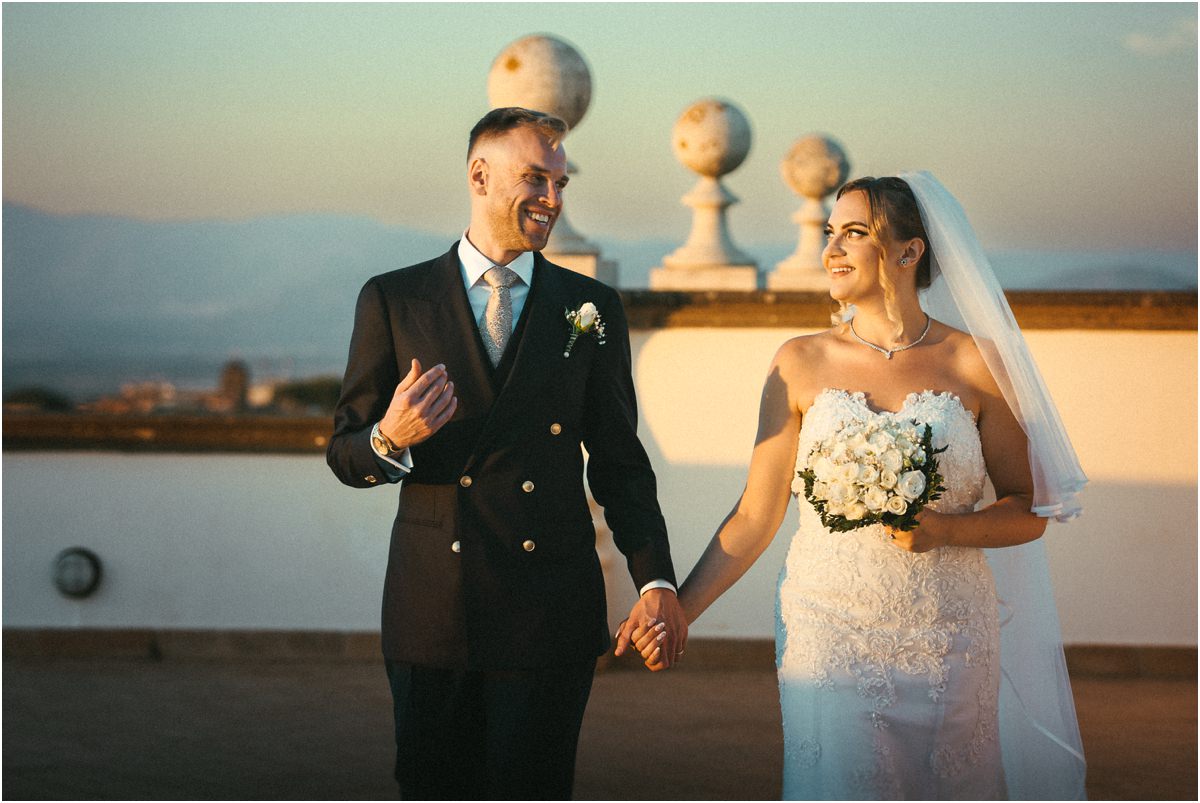 Holding Hands on the Terrace of Villa Grazioli Miriana and Angus smiling and holding hands on the balustrade terrace of Villa Grazioli