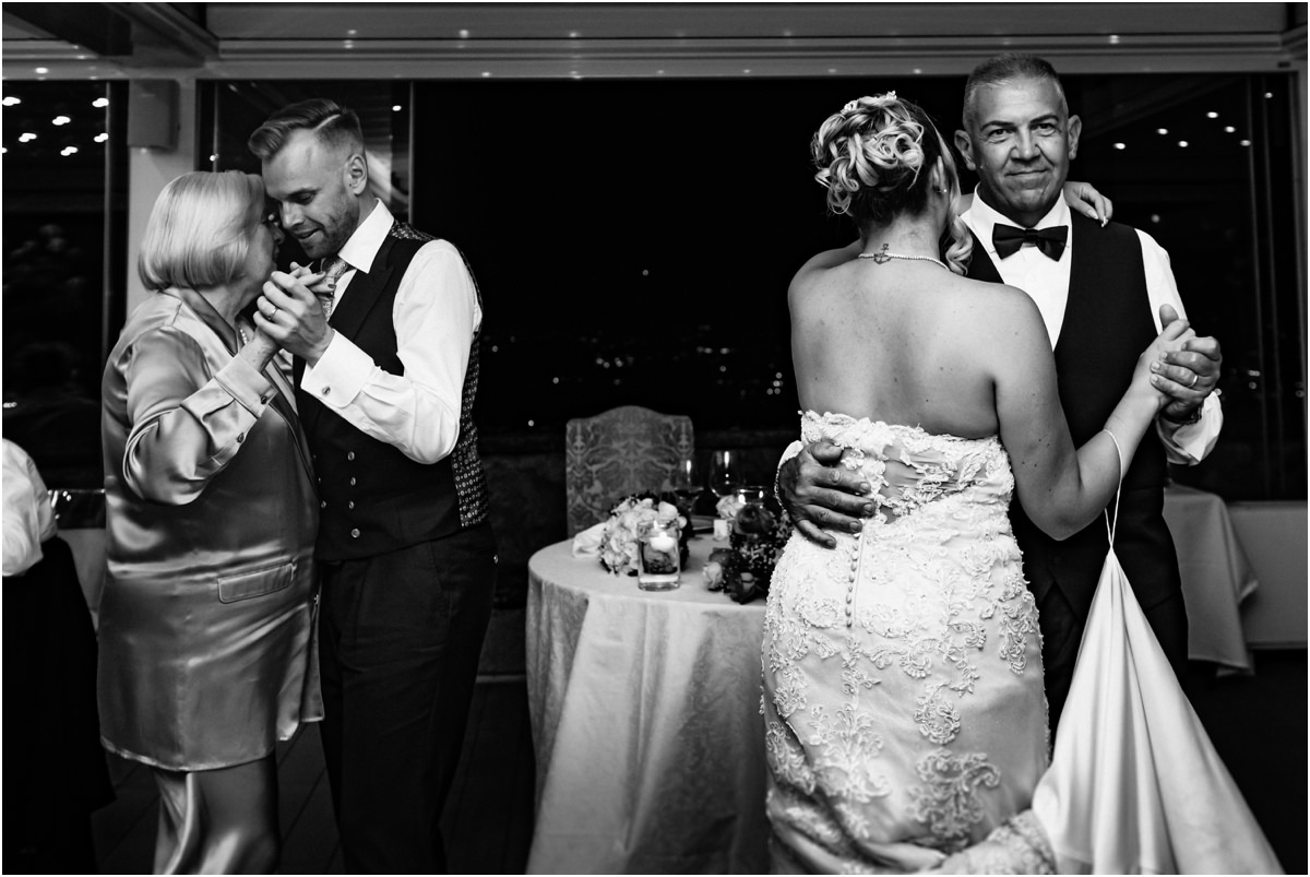 Family Dances, Black and White Black and white photo of Miriana dancing with a man in a tuxedo and Angus dancing with a woman in a satin suit