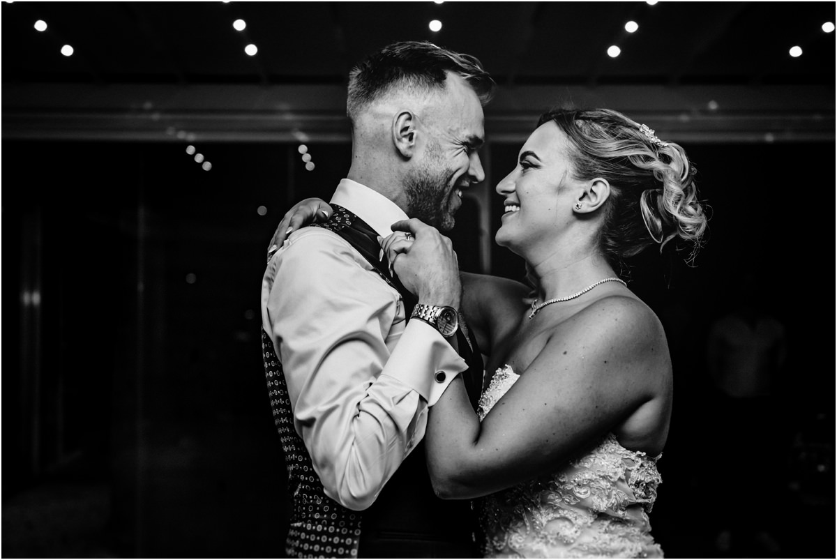 Laughing During the First Dance Black and white photo of Miriana and Angus laughing face to face during their first dance