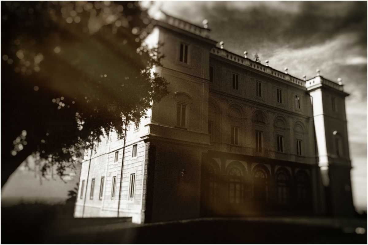 Villa Grazioli on the Wedding Morning Park Hotel Villa Grazioli in Grottaferrata, backlit under a dramatic sky on the morning of Alessio and Leah's intimate wedding