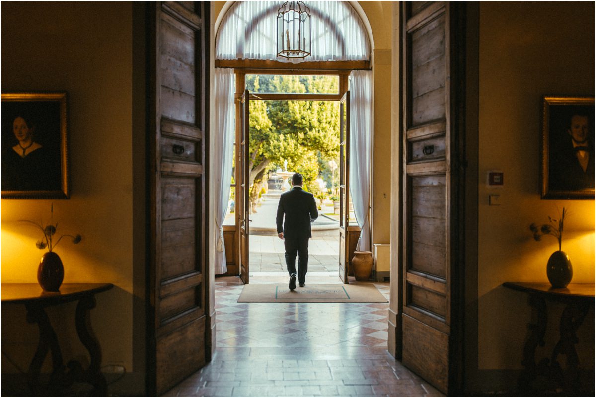 Groom Walking Towards the Park Groom Alessio walking out through the main doorway of Villa Grazioli towards the park