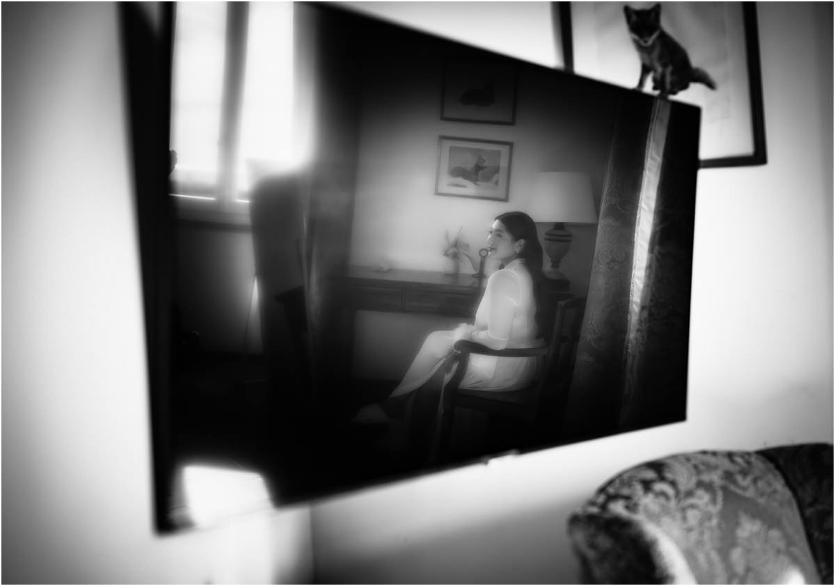 Leah Reflected in the Mirror Black and white photo of bride Leah sitting by the window, reflected in a tilted mirror
