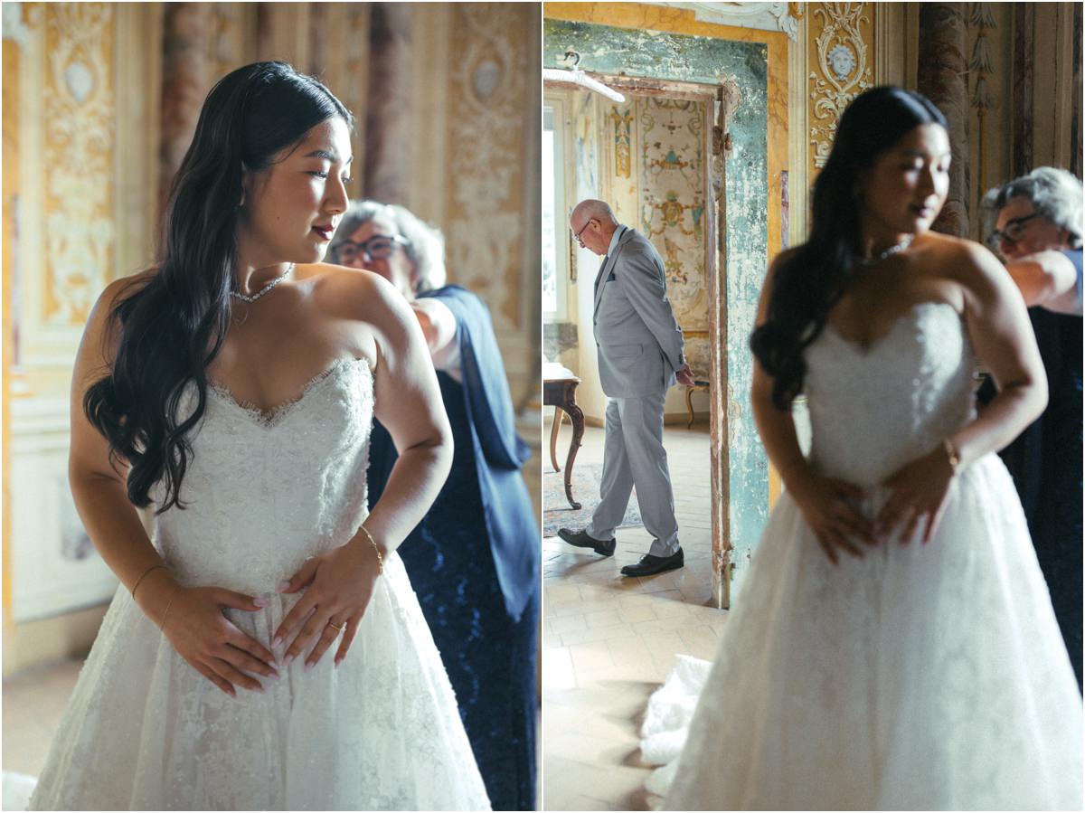 Bride Adjusting her Dress Bride Leah adjusting her strapless lace dress in a frescoed room of Villa Grazioli