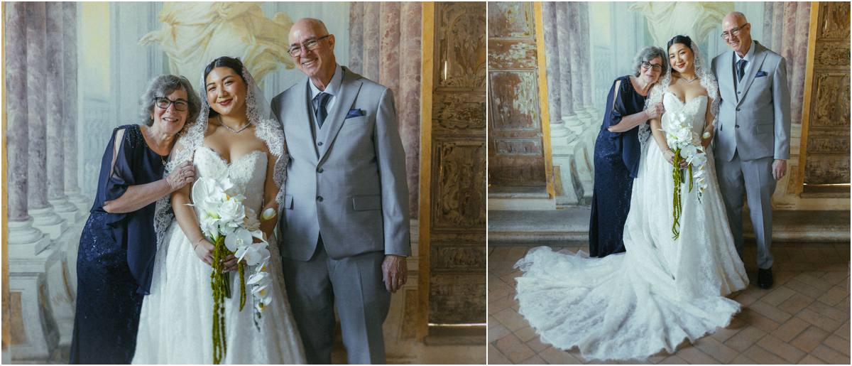 Bride with Family Bride Leah smiling with two family members in a frescoed room of Villa Grazioli, holding her orchid bouquet