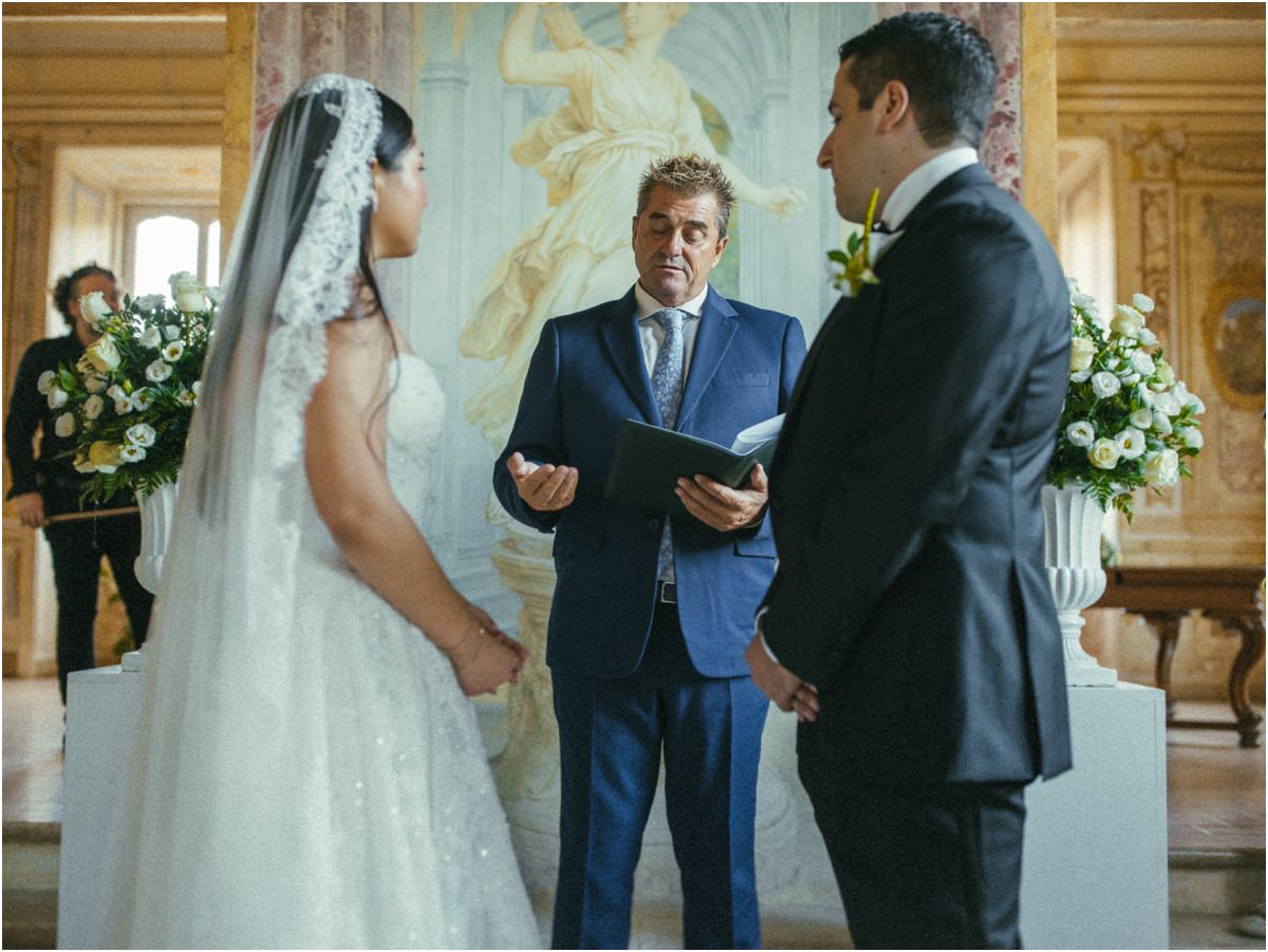 The Officiant Reading The officiant reading during Alessio and Leah's civil ceremony, the couple standing in front of him