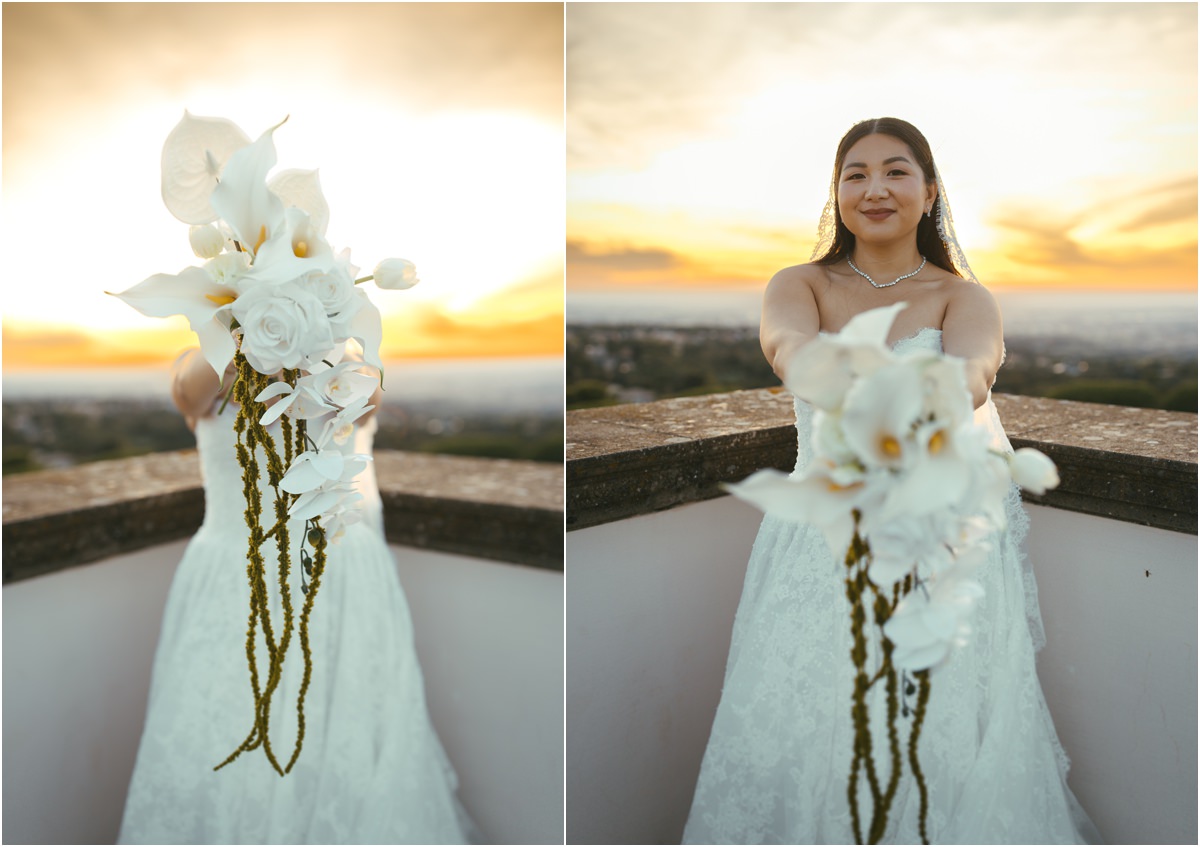 Leah and her Orchid Bouquet Bride Leah smiling and holding out her cascading white orchid bouquet at sunset