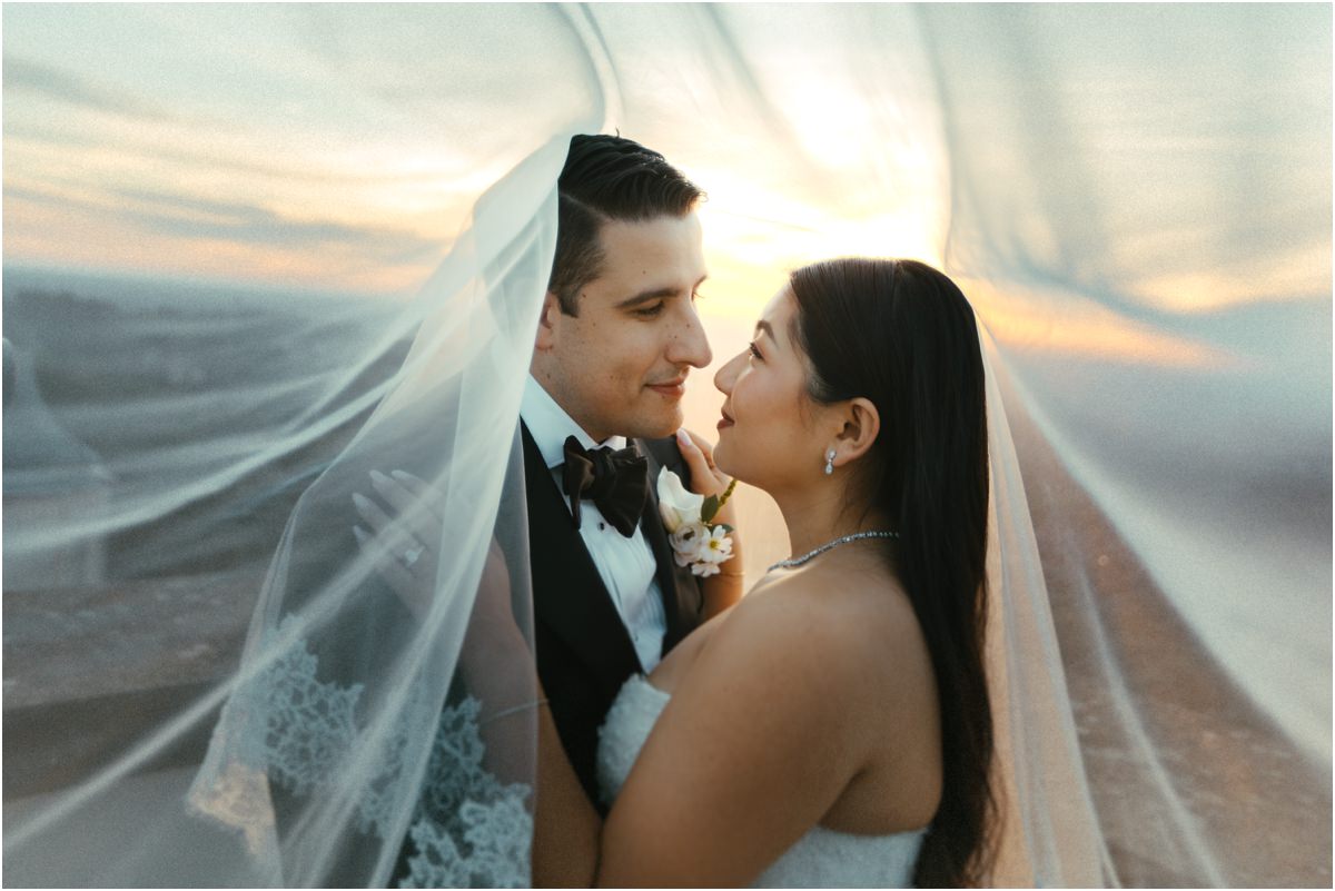 Wrapped in the Veil Alessio and Leah wrapped in her long veil blown by the wind on the terrace