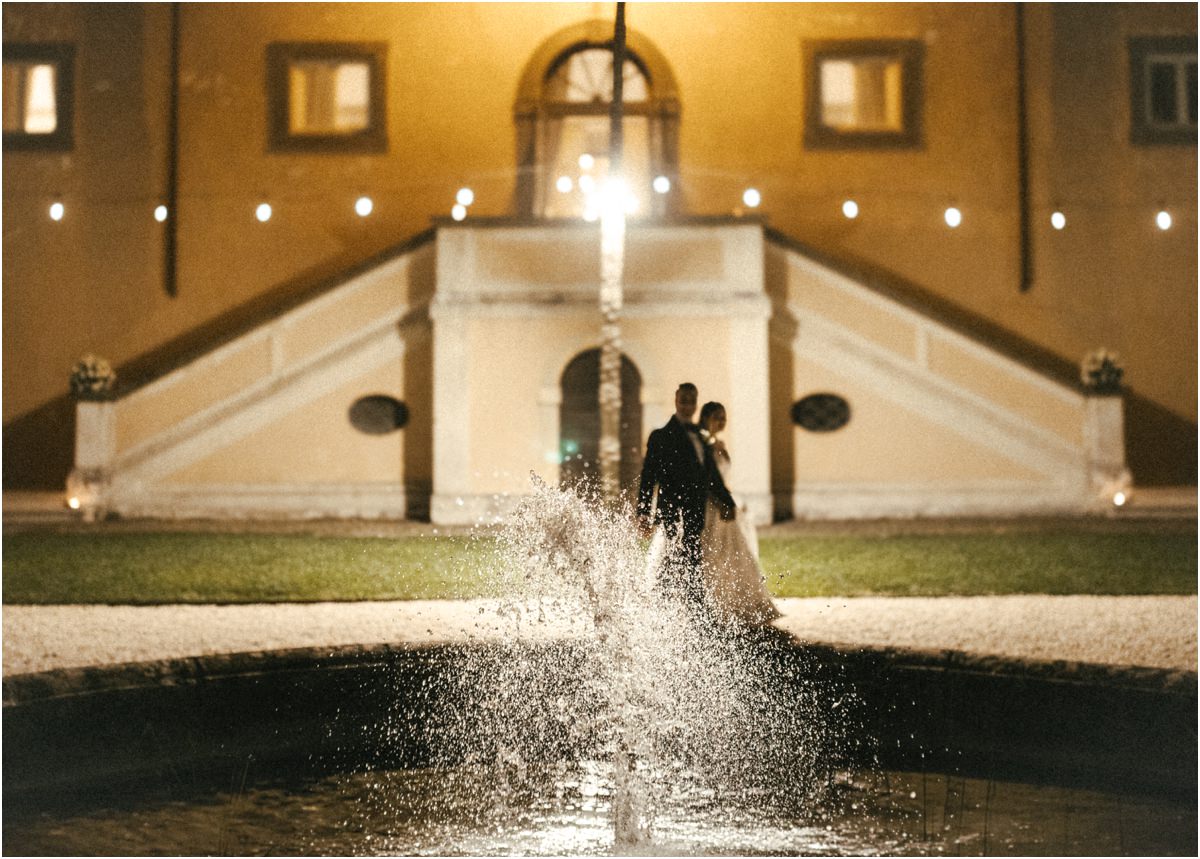 Night at the Fountain Alessio and Leah at night in front of Villa Grazioli, the fountain splashing in the foreground under string lights