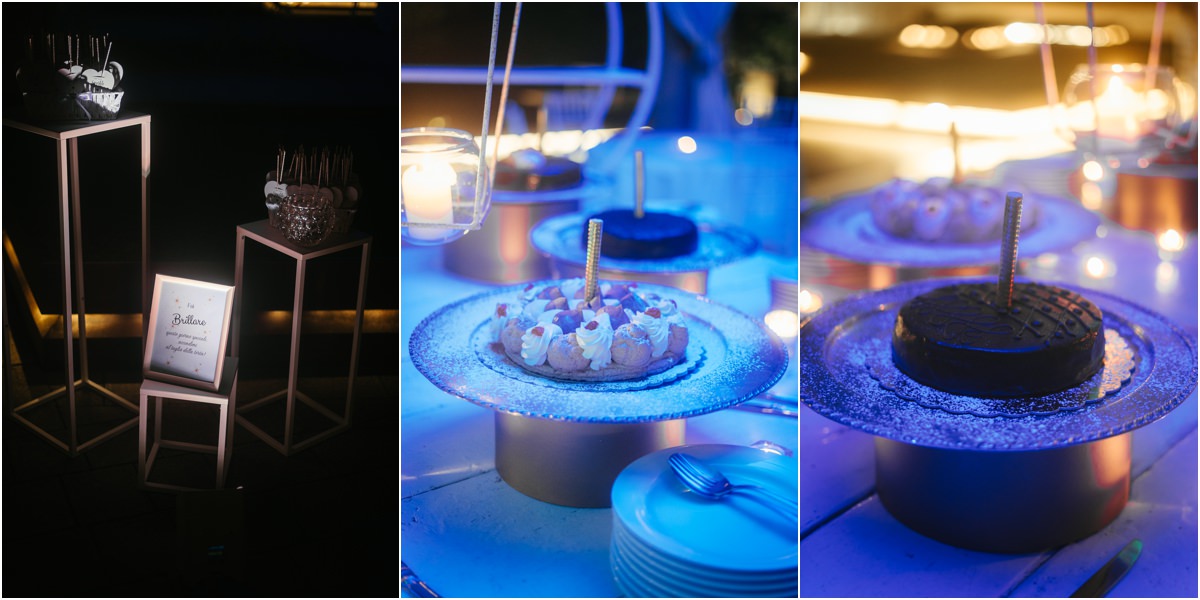 Il buffet dei dolci Dettagli del buffet dei dolci con luci blu e candele a Le Jardin Potager